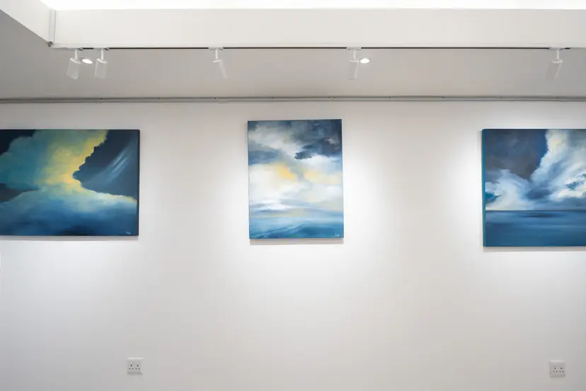 Interior view of the gallery showing artwork on the walls.